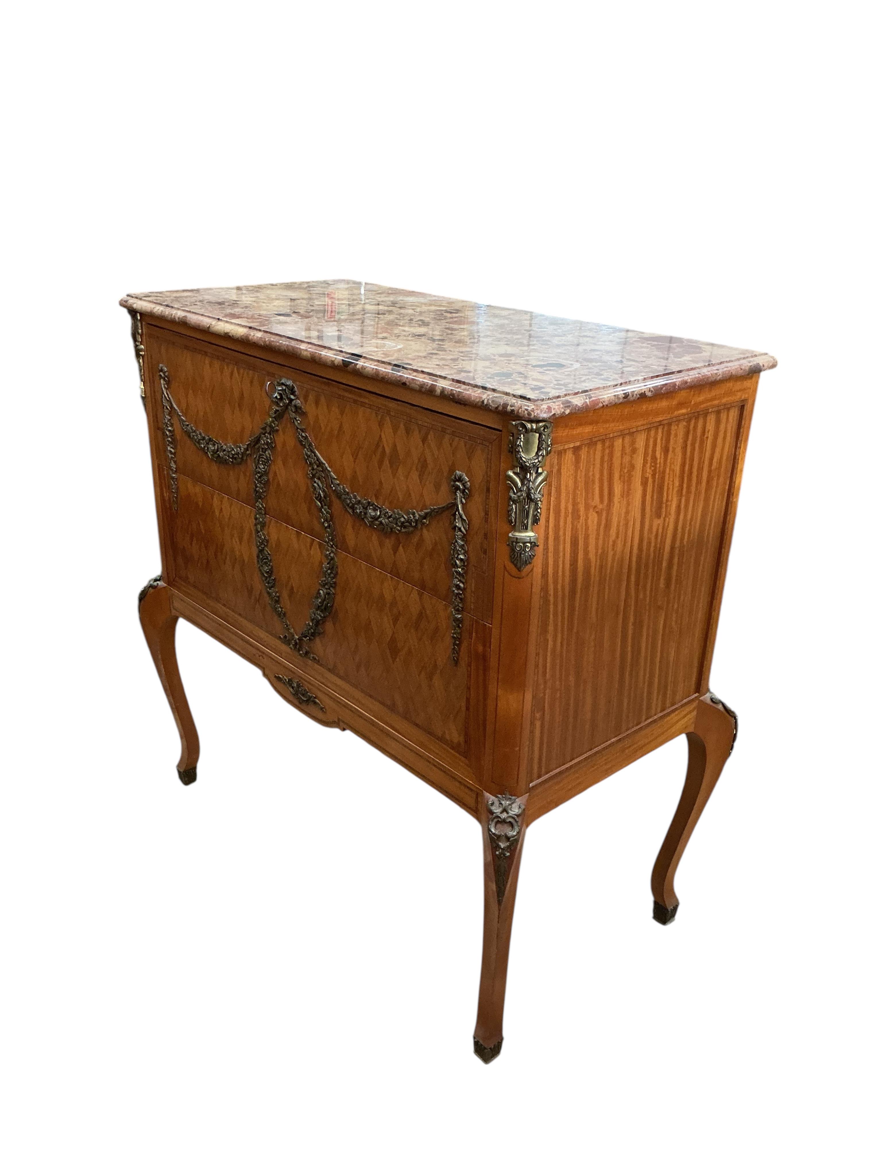 An early 20th century French transitional style gilt metal mounted parquetry inlaid marble top secretaire chest, width 99cm, depth 50cm, height 101cm